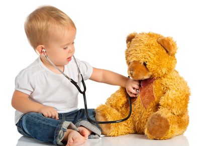 Toddler Playing Doctor With Teddy Bear At Maryland Pediatric Care