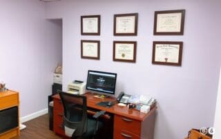 pediatrician's desk and diplomas