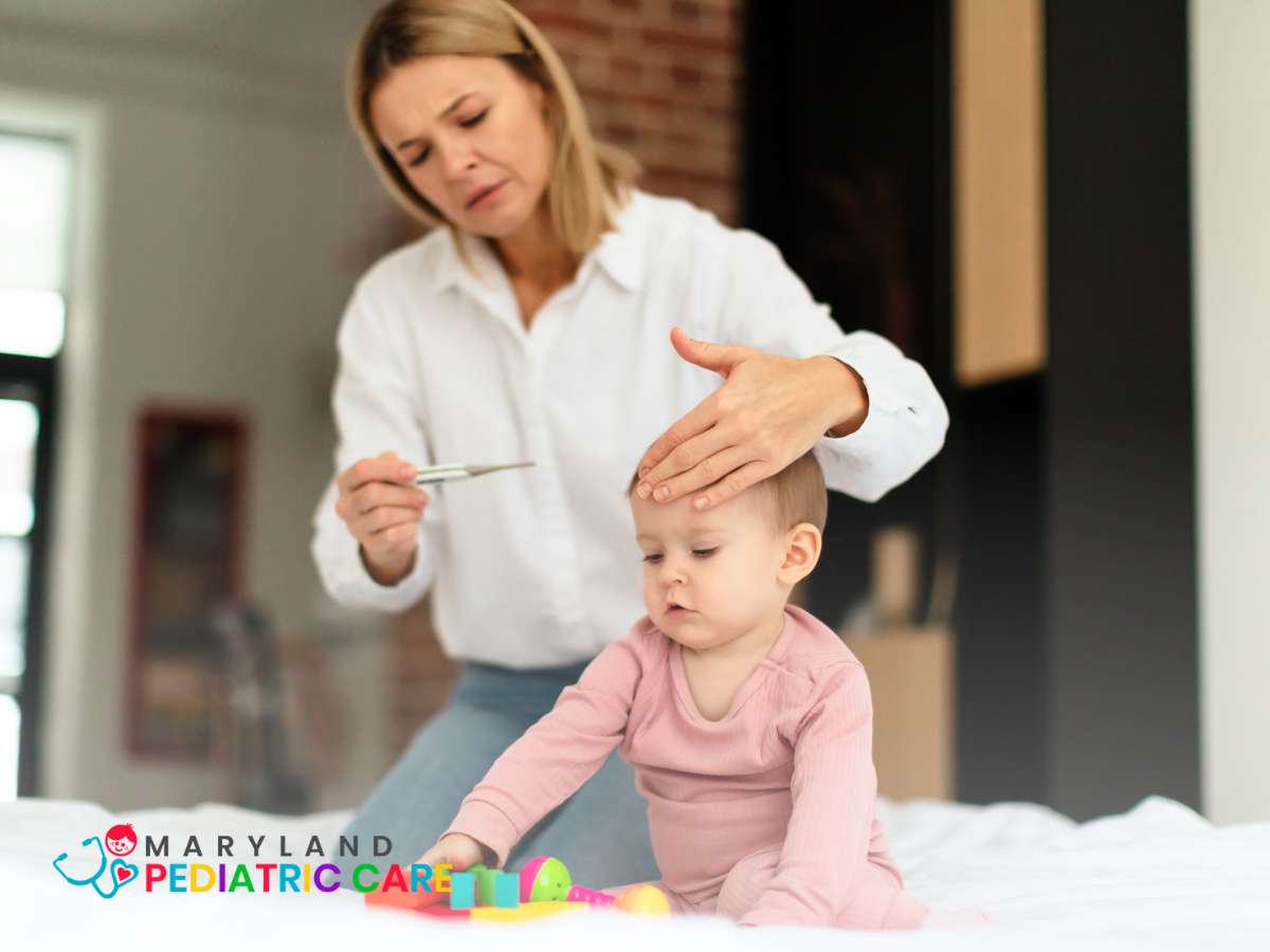 Mother checking temperature to her sick baby 